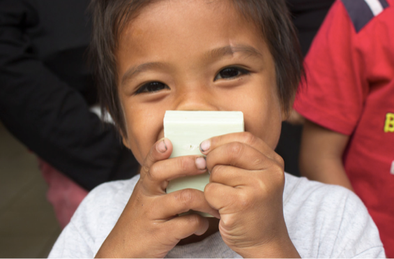 Happy child with soap - Clean the World Asia